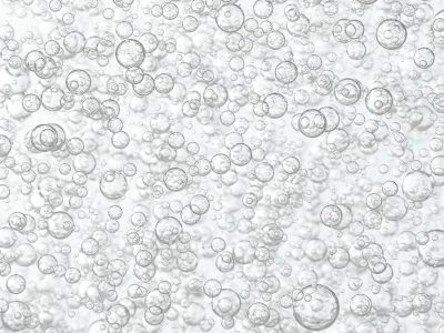 Light gray liquid bubbles flows to the surface.